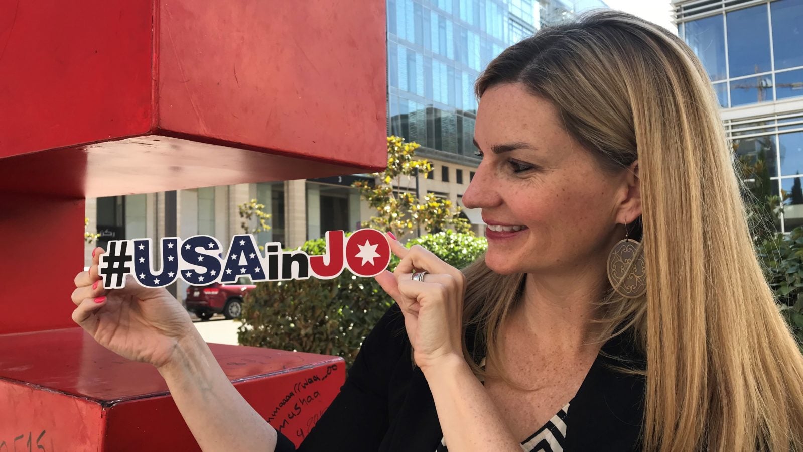 Kala Carruthers Azar with the hashtag of the U.S. Embassy in Jordan: #USAinJo.