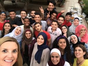A group of young Jordanian filmmakers celebrating the completion of a documentary workshop with American producers.