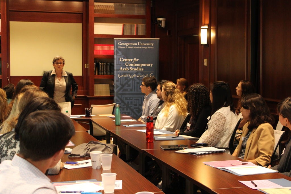 Professor Fida Adely talking to new students at orientation