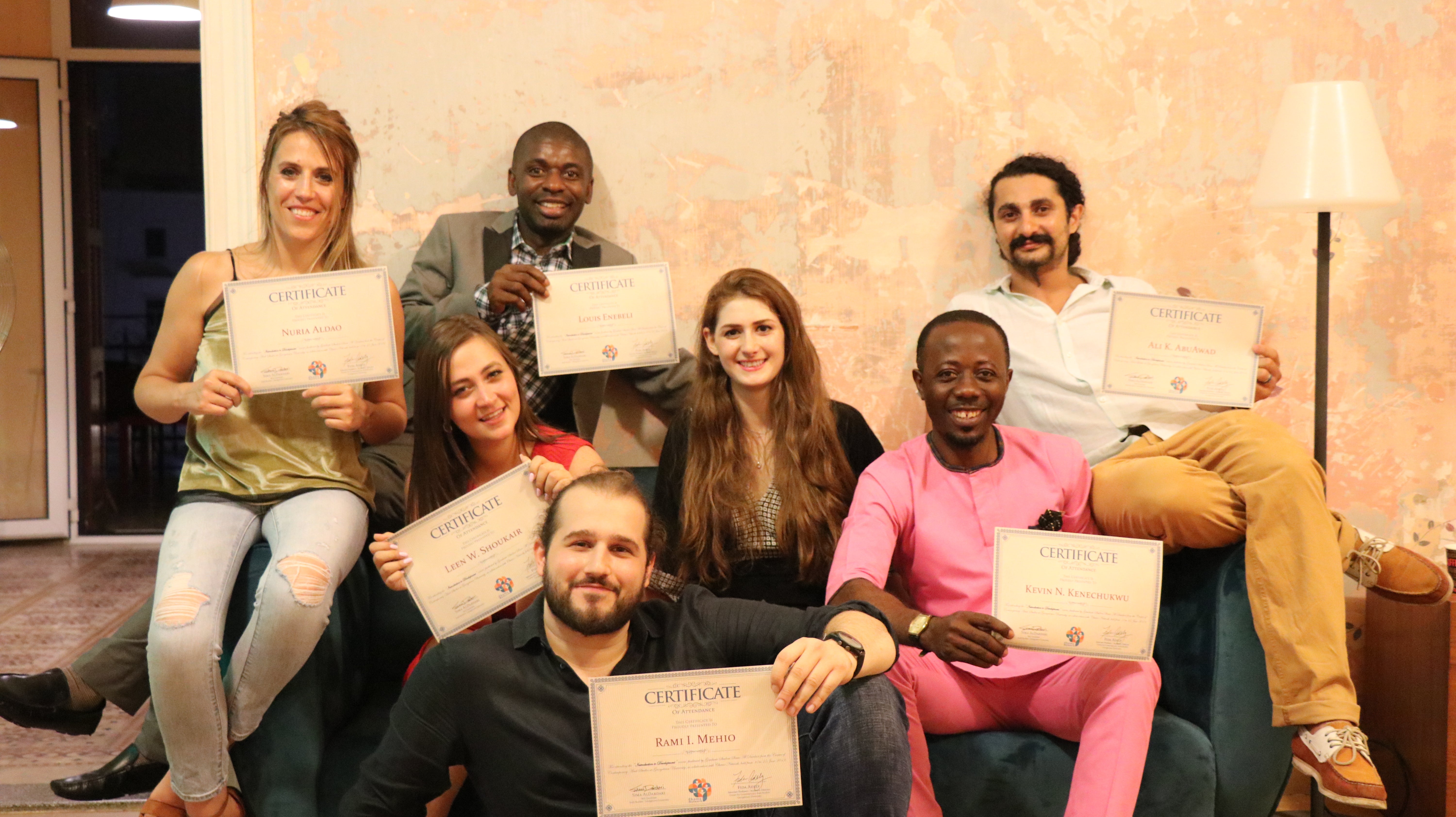 Sima (center) with her students after distributing their course completion certificates. (L to R) Nuria Aldao, Louis Enebeli, Leen Shoukair, Rami Mehio, Kevin Kenechukwu, Ali AbuAwad, and Nour Nahhas (not pictured). Photo Credit: Anthony Zahr, Chams Network