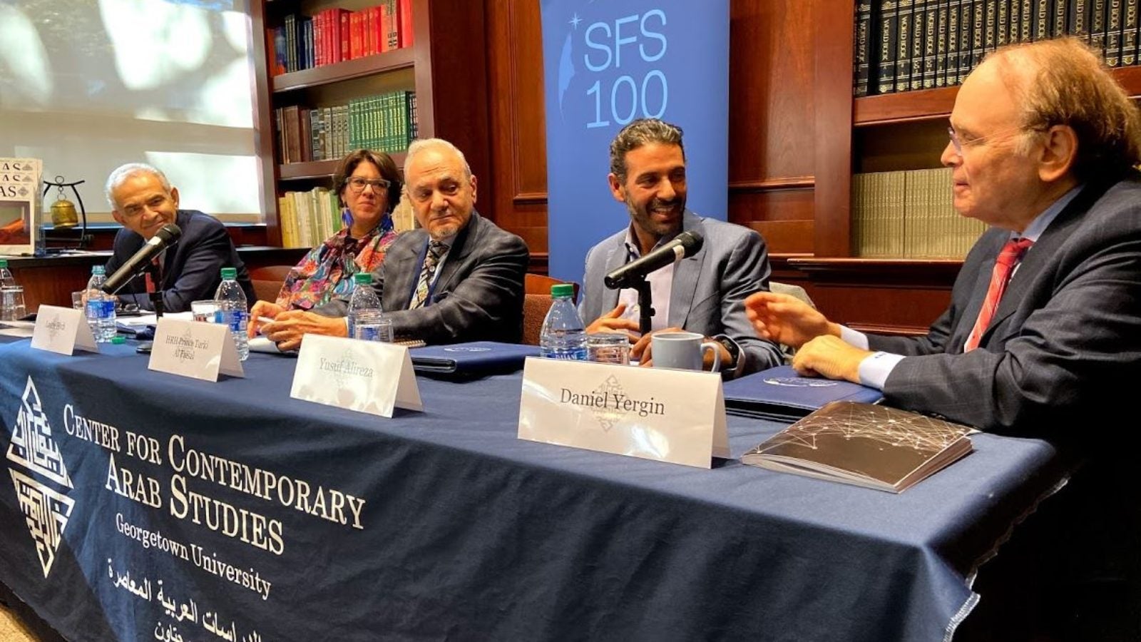 A group of panelists speaking at the event