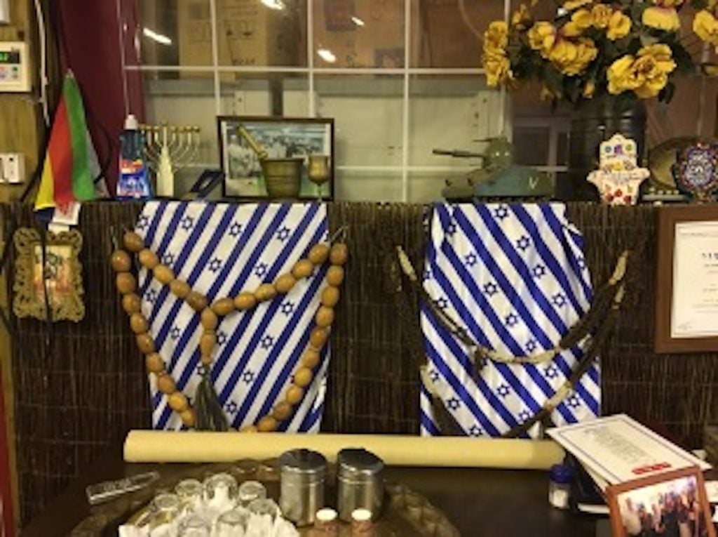 Israeli flag fabric draped in a display