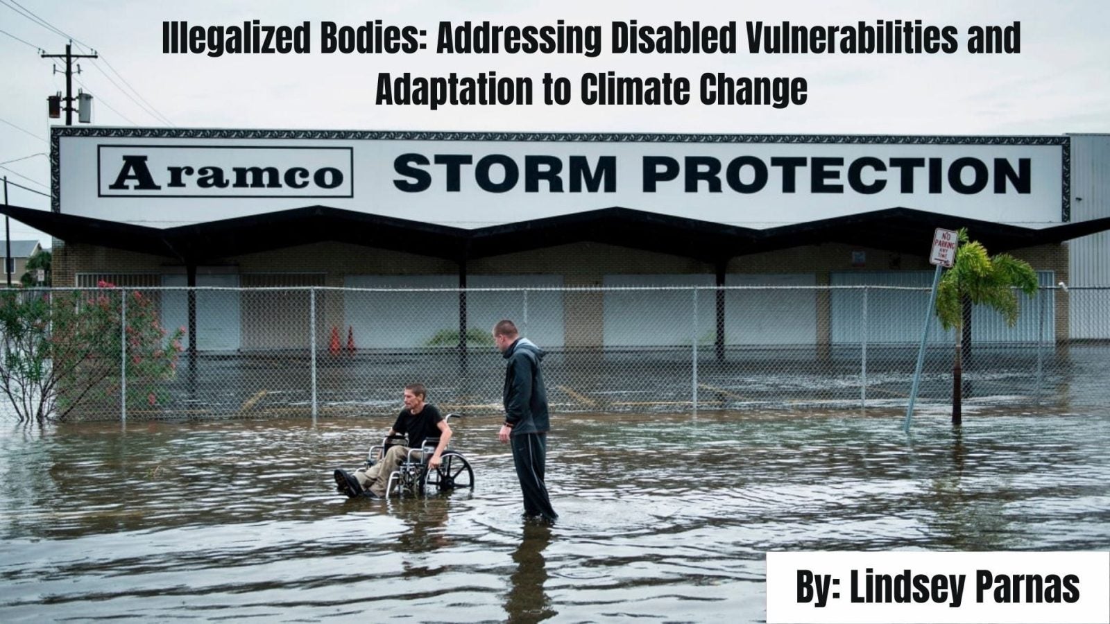 Man in a wheelchair navigating a flooded area