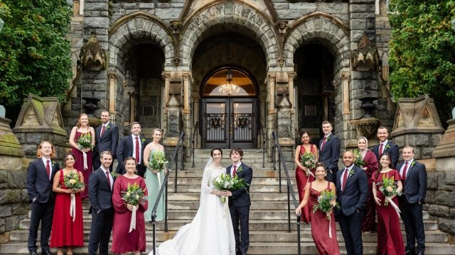 Mark and Meghan pictured in front of Healy Hall with their wedding party.