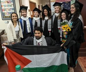 Students at MAAS gather holding the Palestinian flag